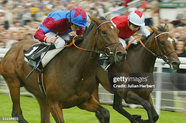 Ryan Moore and Dubai Surprise get the better of the Kevin Darley partnered Nanabanana to land The Citroen C5 Prestige Stakes Race run at Goodwood...