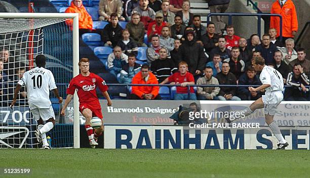 Bolton's Ken Davies scores to make it 1-0 against Liverpool, 29 August 2004, during today's Premiere League clash at The Reebock Stadium, Bolton. AFP...