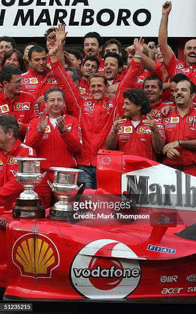 Michael Schumacher of Germany and Ferrari celebrates with his team-mates after winning the Driver's Championship at the Belgium F1 Grand Prix at the...
