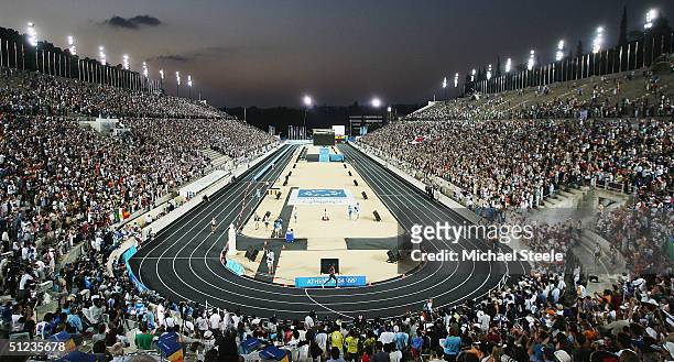 Runners enter the stadium and near the finish during the men's marathon on August 29, 2004 during the Athens 2004 Summer Olympic Games at...