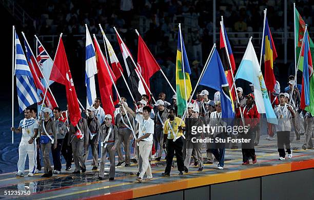 Athletes are seen as they carry their respective flags during the closing ceremony of the Athens 2004 Summer Olympic Games on August 29, 2004 at the...