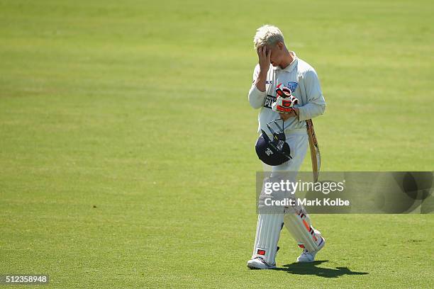 Nic Maddinson of the Blues looks dejected as he leaves the field after being dismissed during day two of the Sheffield Shield match between New South...