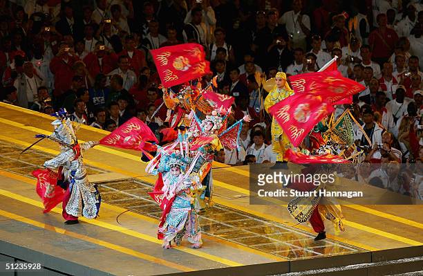Chinese performers take part to mark the handing over of the Games to Beijing in 2008 during the closing ceremonies of the Athens 2004 Summer Olympic...