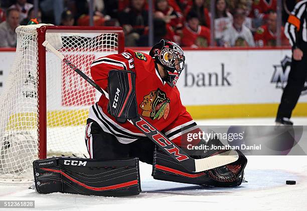 Corey Crawford of the Chicago Blackhawks makes a save against the Nashville Predators at the United Center on February 25, 2016 in Chicago, Illinois.