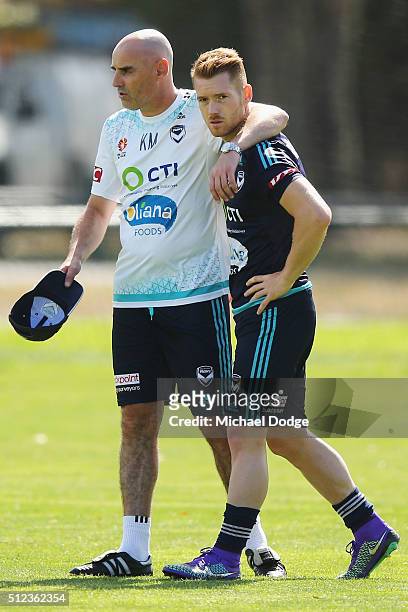 Victory head coach Kevin Muscat hugs Oliver Bozanic of the Victory after talking to him at length during a Melbourne Victory A-League training...