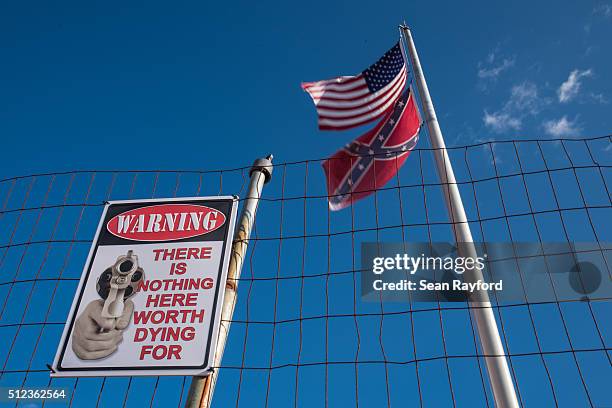An American and a Confederate battle flag fly at a motorcycle club on Thursday, February 25, 2016 in Heath Springs, South Carolina. The South...