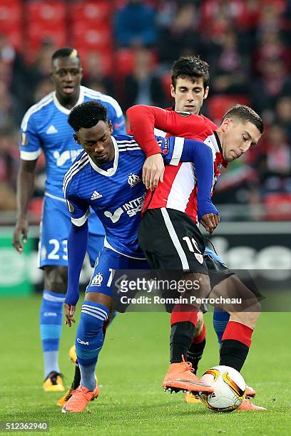 Oscar De Marcos of Bilbao and Georges Kevin Nkoudou of Marseille battle for the ball during the UEFA Europa League Football round of 32 second leg...