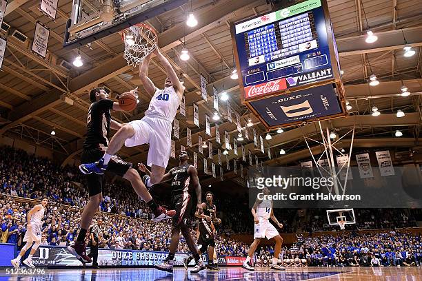 Marshall Plumlee of the Duke Blue Devils dunks over Boris Bojanovsky of the Florida State Seminoles during their game at Cameron Indoor Stadium on...