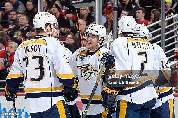 Viktor Arvidsson of the Nashville Predators celebrates with teammates after scoring in the second period of the NHL game against the Chicago...