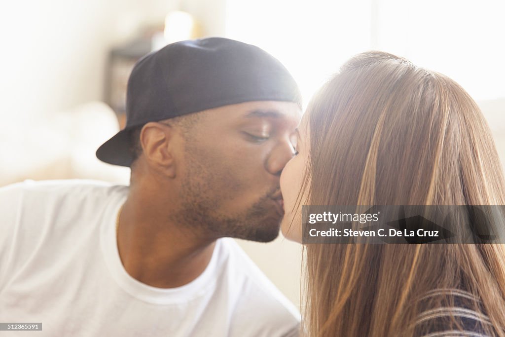 Mid adult couple kissing