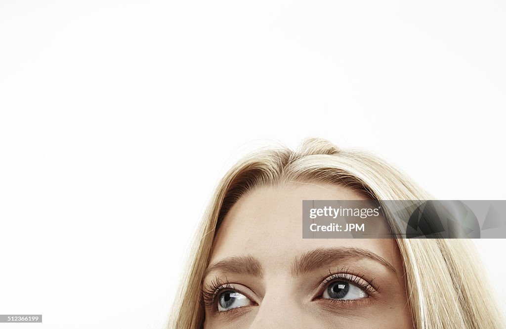 Cropped close up studio portrait of young woman's eyes