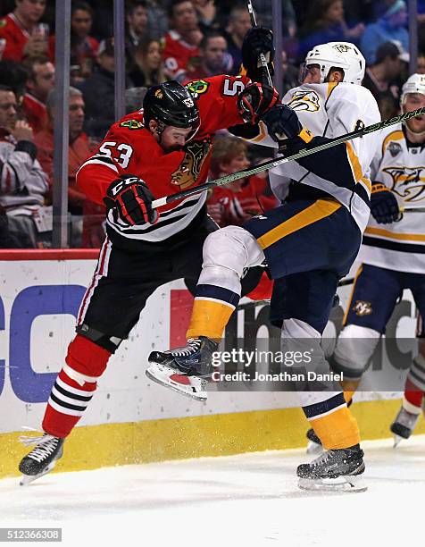 Brandon Mashinter of the Chicago Blackhawks colides with Petter Granberg of the Nashville Predators at the United Center on February 25, 2016 in...