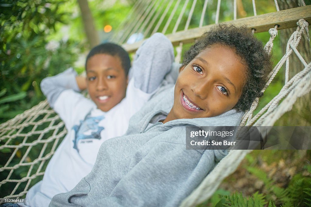 Boys lying in a hammock