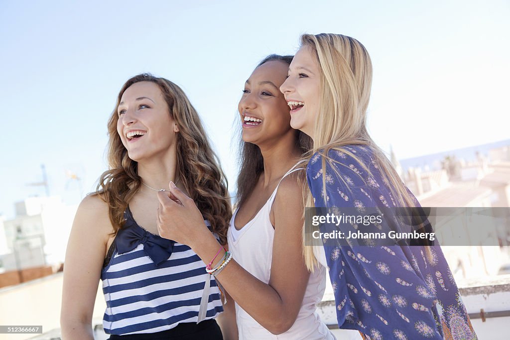 Teenage girls laughing