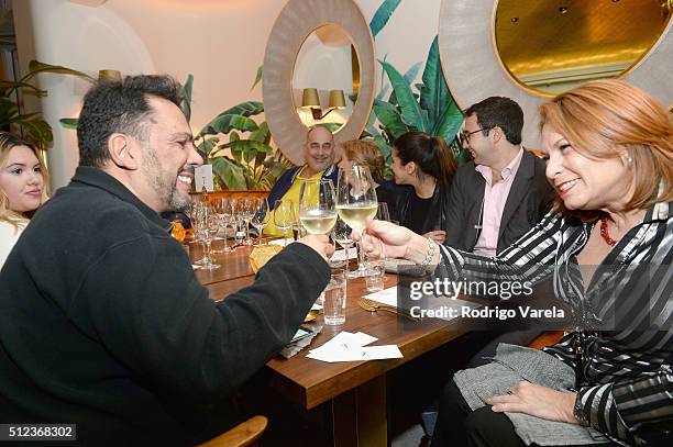 Guests enjoy a Dinner Hosted By Francis Mallmann And Paul Qui during 2016 Food Network & Cooking Channel South Beach Wine & Food Festival Presented...