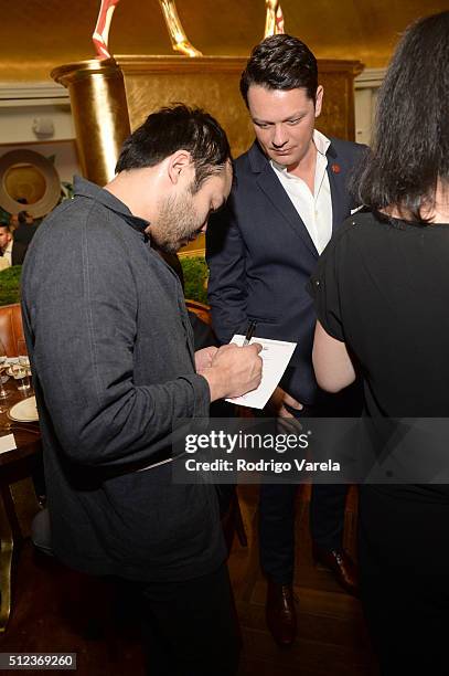 Chef Paul Qui signs an autograph at a Dinner Hosted By Francis Mallmann And Paul Qui during 2016 Food Network & Cooking Channel South Beach Wine &...