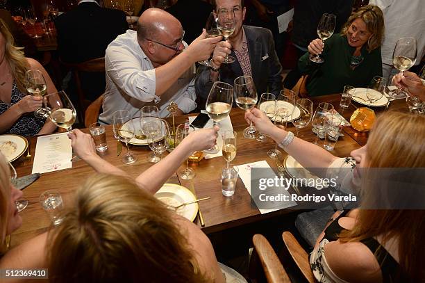 Guests enjoy a Dinner Hosted By Francis Mallmann And Paul Qui during 2016 Food Network & Cooking Channel South Beach Wine & Food Festival Presented...