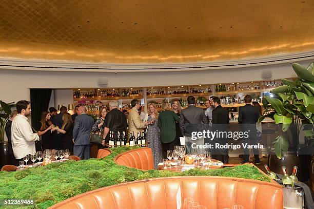 Guests enjoy a Dinner Hosted By Francis Mallmann And Paul Qui during 2016 Food Network & Cooking Channel South Beach Wine & Food Festival Presented...