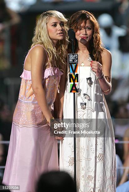 Actresses Ashley and Mary-Kate Olsen appears onstage at the 2004 MTV Video Music Awards at the American Airlines Arena August 29, 2004 in Miami,...