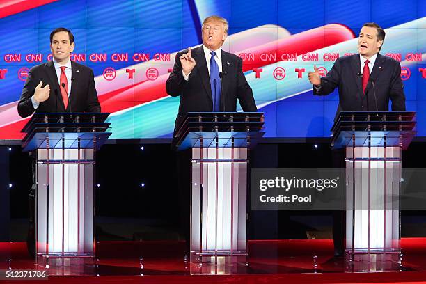 Republican presidential candidates, Sen. Marco Rubio , Donald Trump and Sen. Ted Cruz listen as answers a question during the Republican presidential...