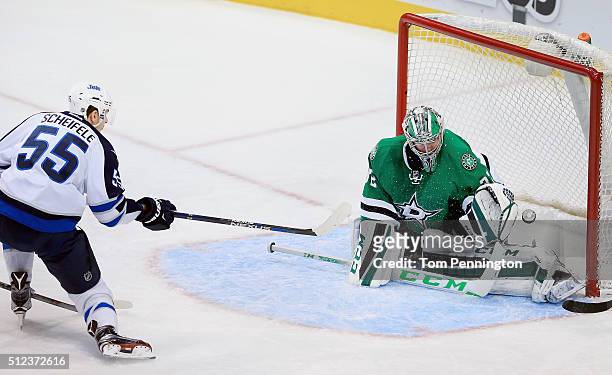 Mark Scheifele of the Winnipeg Jets scores a goal against Kari Lehtonen of the Dallas Stars in the third period at American Airlines Center on...