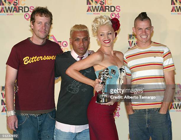 Tom Dumont, Tony Kanal, Gwen Stefani and Adrian Young of No Doubt pose with their Best Pop Video award for "It's My Life" in the press room at the...