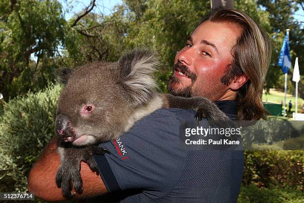 Victor Dubuisson of France poses with Sunshine the koala during day two of the 2016 Perth International at Karrinyup GC on February 26, 2016 in...