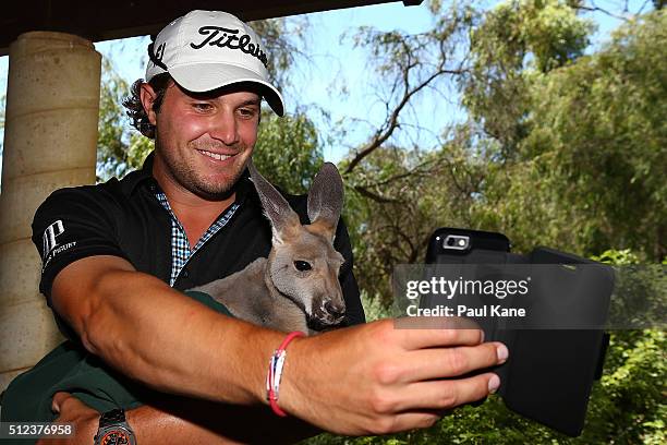 Peter Uihlein of the USA takes a selfie with Lilo the kangaroo during day two of the 2016 Perth International at Karrinyup GC on February 26, 2016 in...