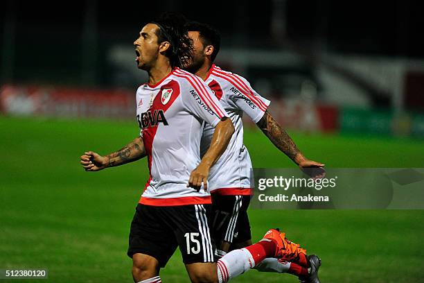 Leonardo Pisculichi of River Plate celebrates with teammate Tabare Viudez after scoring the opening goal during a group stage match between...