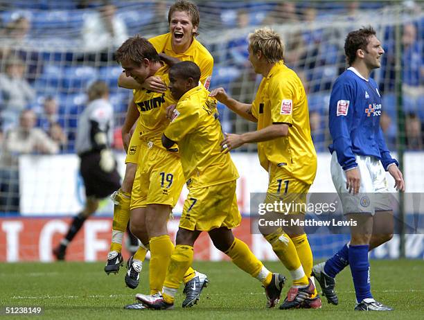 Adam Virgo of Brighton is congratulated by team amates after scoring during the Coca-Cola Championship match between Leicester City and Brighton and...