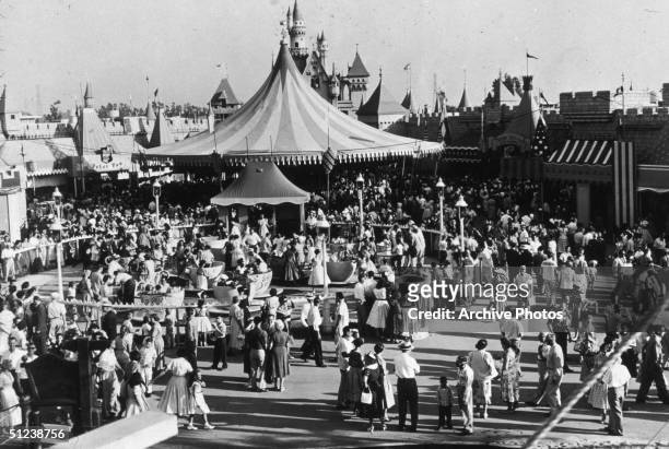 Circa 1955, Crowds walking around the Disneyland theme park in Anaheim, California.