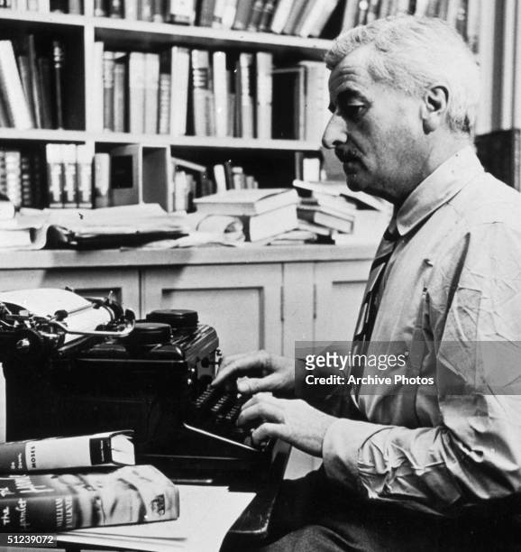 Circa 1945, American writer William Faulkner working at his typewriter in his study at home in Oxford, Mississippi.