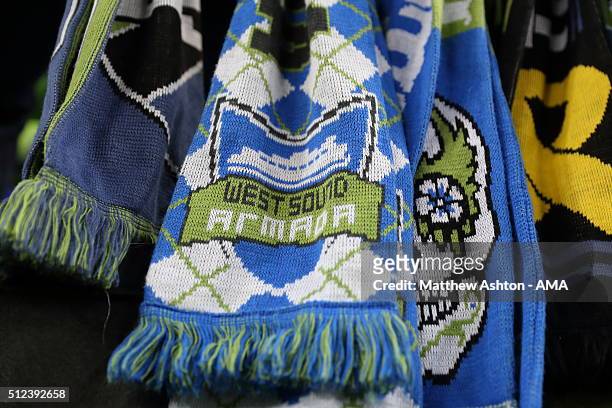 Fans of the Seattle Sounders tie scarfs to the barrier during the CONCACAF Champions League match between Seattle Sounders and Club America at...