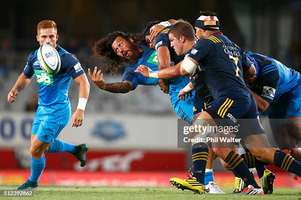 Rene Ranger of the Blues offloads the ball during the round one Super Rugby match between the Blues and the Highlanders at Eden Park on February 26,...