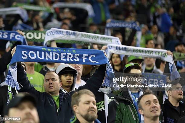 Fans of the Seattle Sounders hold up scarfs during the CONCACAF Champions League match between Seattle Sounders and Club America at CenturyLink Field...