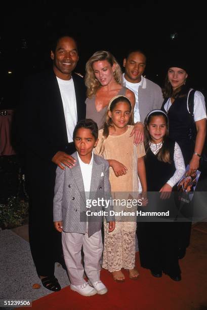 March 1994, Football player and actor O J Simpson poses with his ex-wife Nicole Brown Simpson and their children, at the premiere of director Peter...