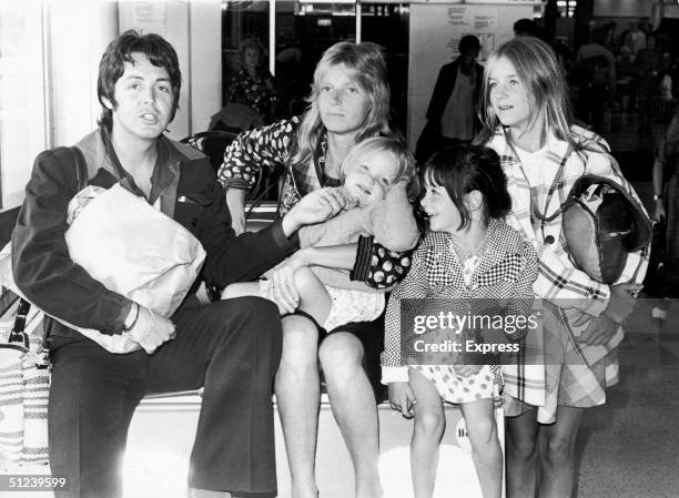 British singer and songwriter Paul McCartney poses with his wife Linda , and their daughters, left to right, Stella, Mary, and Heather, at Heathrow...