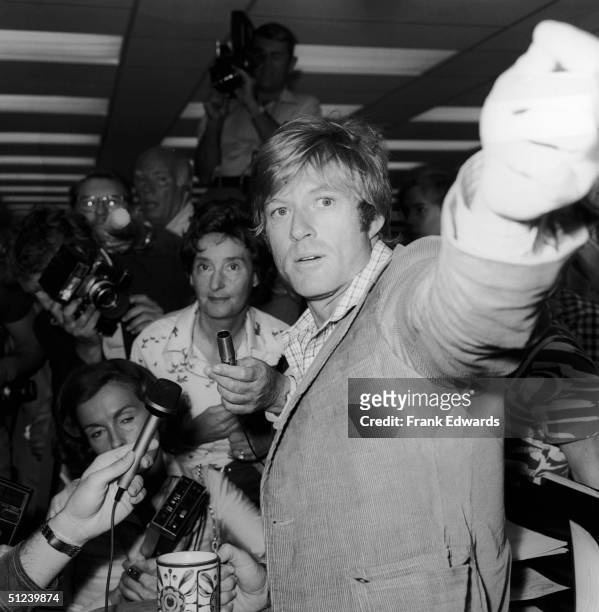 2nd July 1975, American actor Robert Redford speaks to the press on the set of the film, 'All The President's Men,' directed by Alan J. Pakula, July...