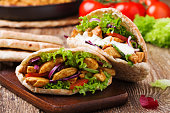Roasted chicken and vegetables, served in pita.