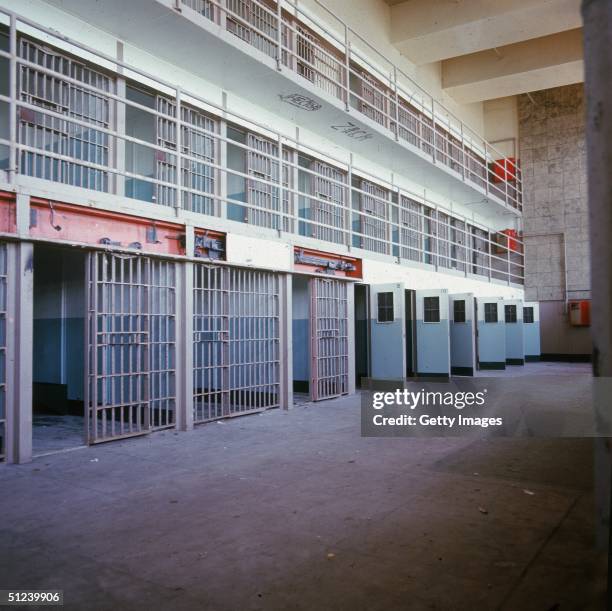 Circa 1965, View of a long corridor inside a cell block at Alcatraz penitentiary, San Francisco, California, 1960s.