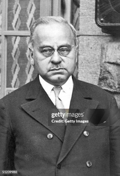 Portrait of Austrian psychoanalyst Dr. Alfred Adler , dressed in a double breastest suit coat and tie, as he stands outdoors, 1930s.