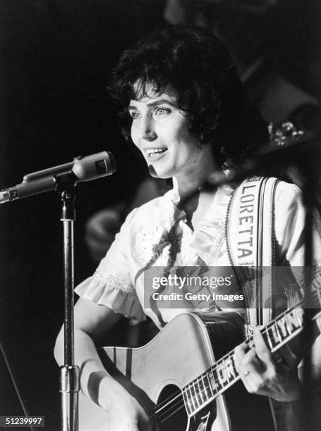 Circa 1965, American country singer and songwriter Loretta Lynn performs on stage at the Grand Ole Opry, Nashville, Tennessee, 1960s.