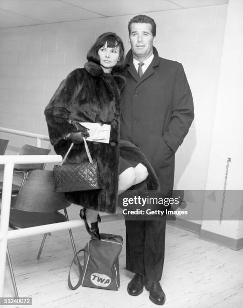 21st February 1964, American actor James Garner and his wife, Lois Clarke, inside John F Kennedy airport prior to boarding a flight for England, New...