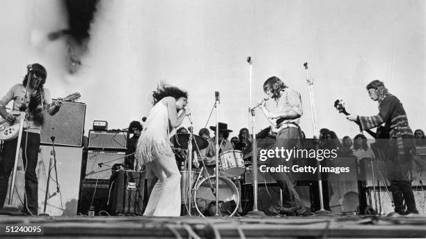 Singer Grace Slick performs with the American rock group Jefferson Airplane at Woodstock music festival.