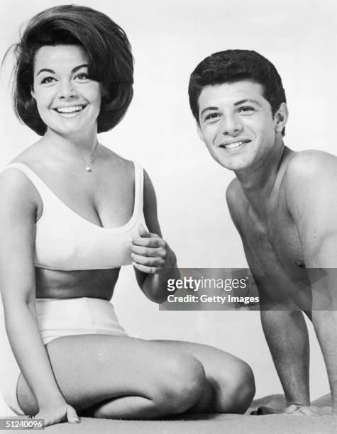 Promotional portrait of American actors Annette Funicello and Frankie Avalon for the film 'Beach Party' directed by William Asher.