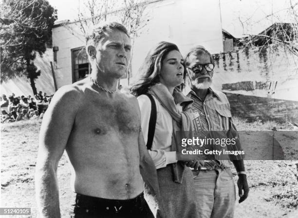 Steve McQueen and Ali MacGraw with director Sam Peckinpah on the set of Peckinpah's film 'The Getaway'.