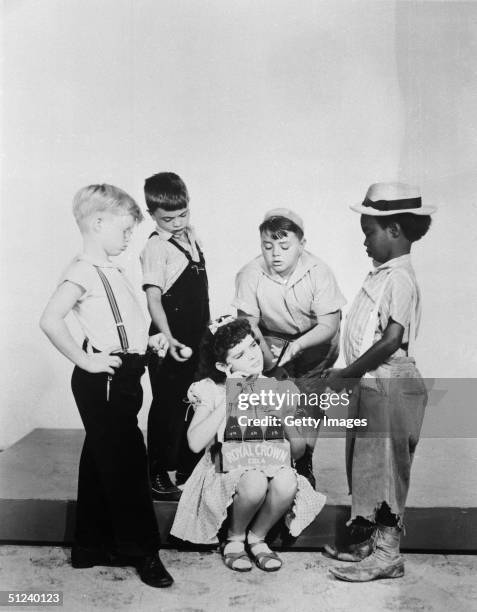 Circa 1940, Promotional portrait for the film series, 'Our Gang' . Standing, left to right: Billy Laughlin , Robert Blake, George McFarland and...