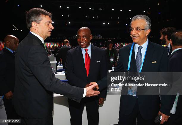 Presidential candidates Jerome Champagne and Sheikh Salman Bin Ebrahim Al Khalifa shake hands with Tokyo Sexwale prior to the Extraordinary FIFA...