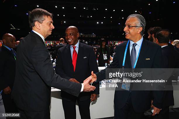 Presidential candidates Jerome Champagne and Sheikh Salman Bin Ebrahim Al Khalifa shake hands with Tokyo Sexwale prior to the Extraordinary FIFA...