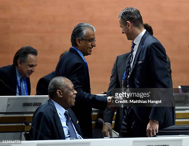 Presidential candidate Sheikh Salman Bin Ebrahim Al Khalifa shakes hands with FIFA Acting Secretary General Markus Kattner as FIFA Acting President...